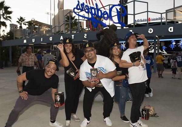 Group of five alumni posing and having fun at Cal State LA Dodger Night 2022